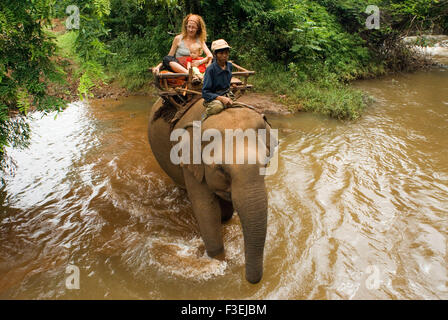 Elephant rides from village Kateung. Travel with children. Ratanakiri. But for the more intrepid, both Mondulkiri and Ratanakiri Stock Photo