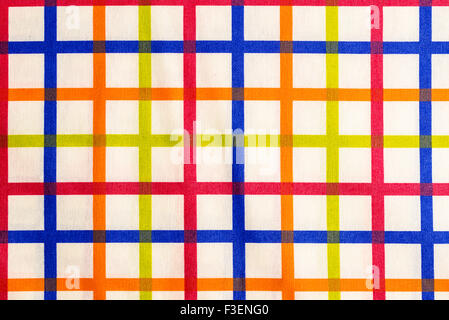 Closeup of a colorful striped tablecloth forming squares Stock Photo