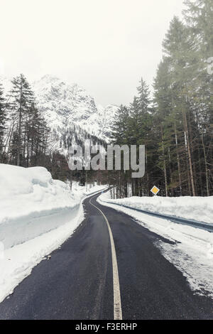 Empty mountain road on a cloudy winter day. Italy Stock Photo