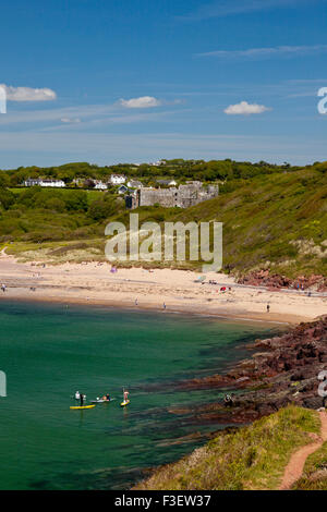 Sea kayakers in Manorbier Bay in the Pembrokeshire Coast National Park, Wales, UK Stock Photo