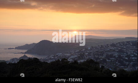 A spectacular sunrise viewed from Torrs Park looking over the North Devon town of Ilfracombe Stock Photo