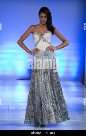 Model poses on the runway in a design by Carlos Vigil (Peru) during Fashion Week Brooklyn, New York City Stock Photo