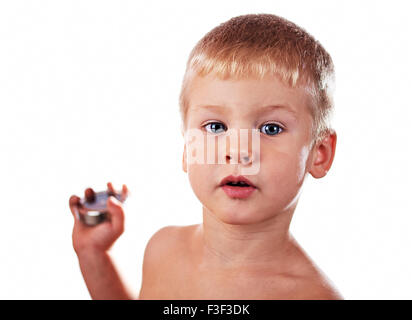 Little boy portrait grimace over white background Stock Photo