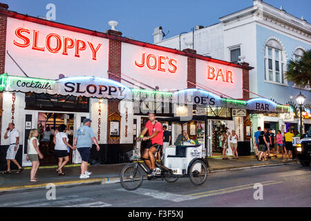 Key West Florida,Keys Old Town,Duval Street,night evening,Sloppy Joe's Bar,front,entrance,pedicab,FL150508089 Stock Photo