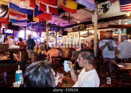 Key West Florida,Keys Old Town,Duval Street,night nightlife evening after dark,Sloppy Joe's Bar,interior inside,visitors travel traveling tour tourist Stock Photo