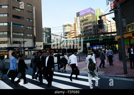 Japanese businessmen on their way home. Stock Photo