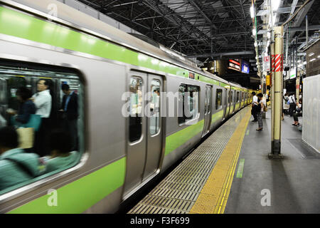 Passengers on the Yamanote line in Tokyo. Stock Photo