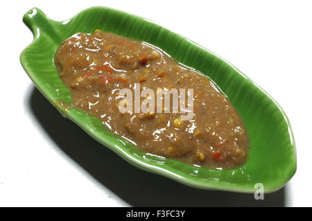 Shrimp paste chili sauce in green dish shape of banana leaf, Thai traditional food Stock Photo