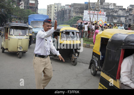 Trafic police controlling trafic during the religious procession at Kalwa Junction ; Thane ; Maharashtra ; India;NO MR Stock Photo