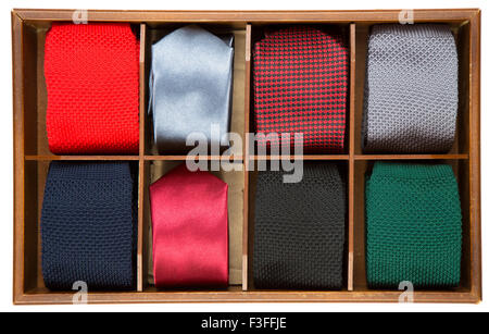 Different patterns and colours of man ties in a wooden box,Isolated on white background Stock Photo
