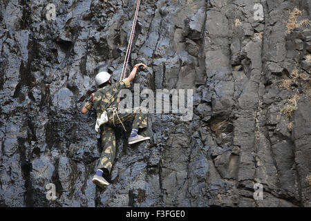 Commando obstacles training rock climbing at Amboli Ghat ; Amboli hill station ; Military school Amboli Sindhudurga Stock Photo