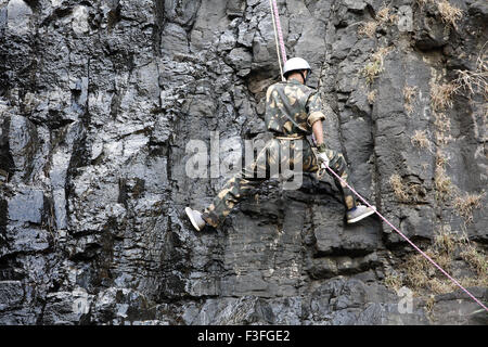 Commando obstacles training rock climbing at Amboli Ghat ; Amboli hill station ; Military school ; Amboli Sindhudurga Stock Photo