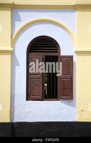 Window of parish hall of Our Lady of Lourdes cathedral has interesting underground shrine ; Thrissur ; Kerala ; India Stock Photo