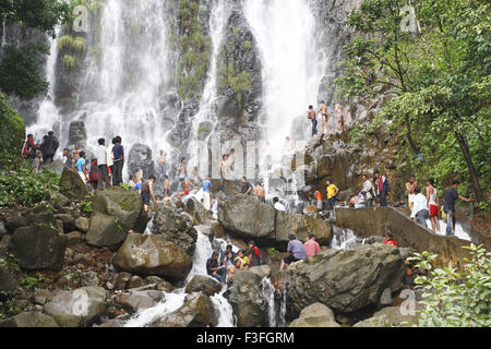 Popular waterfall of Amboli Ghat tourist bathing ; Sawantwadi to Amboli Hill station ; Maharashtra ; India Stock Photo