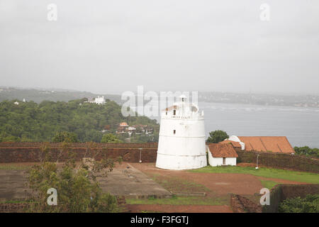 Light House on Aguada seventeenth century Portuguese fort Sinquerim beach in background ; Goa ; India Stock Photo