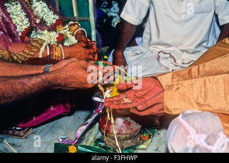 Kanyadan custom in a Bengali marriage ceremony ; India Stock Photo