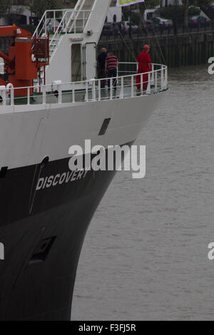 London, UK.  7th October 2015. The National Oceanography Centre's Royal Research Ship (RRS) 'Discovery' arrives in London. Discovery - responsible for oceanographic research - is the 4th ship to bear the name and was built in 2013. The Aerial  shots taken capture the water shooting salute at Canary Wharf, Docklands and the journey upstream towards its mooring point at Tower Bridge, where she will be moored between the 7th and 11th October 2015. Credit:  Glenn Sontag / Alamy Live News Stock Photo