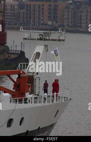 London, UK.  7th October 2015. The National Oceanography Centre's Royal Research Ship (RRS) 'Discovery' arrives in London. Discovery - responsible for oceanographic research - is the 4th ship to bear the name and was built in 2013. The Aerial  shots taken capture the water shooting salute at Canary Wharf, Docklands and the journey upstream towards its mooring point at Tower Bridge, where she will be moored between the 7th and 11th October 2015. Credit:  Glenn Sontag / Alamy Live News Stock Photo