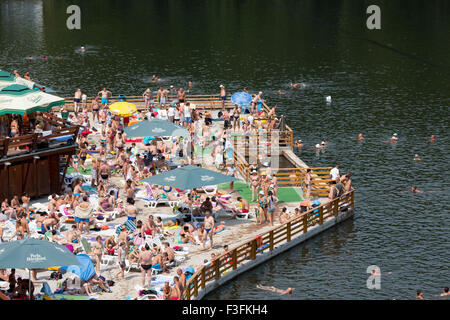 Crowd of people at the Bear Lake (Lacu Ursu) in Sovata, Transylvania, Romania Stock Photo