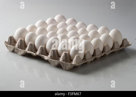 Unbroken eggs arrange in crate Stock Photo