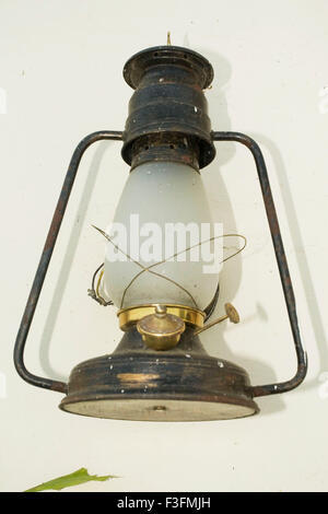 Lantern hanging on wall Stock Photo