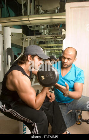 Hrithik Roshan, Indian bollywood hindi movie film actor with gym trainer Satya, Satyajit Chaurasia, India, Asia Stock Photo