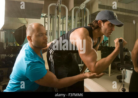 Hrithik Roshan, Indian bollywood hindi movie film actor with gym trainer Satya, Satyajit Chaurasia, India, Asia Stock Photo