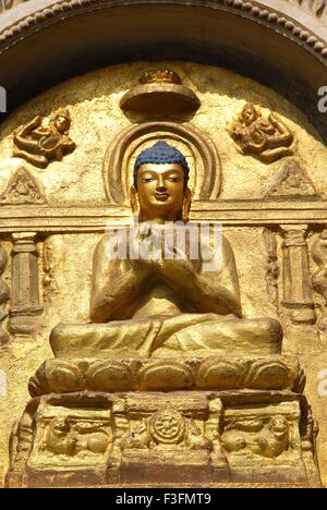 Lord Buddha golden statue in meditation posture ; Gaya ; Bihar ; India Stock Photo