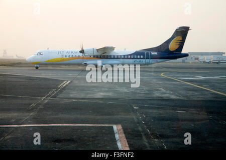 Jet airway's VT JCJ flight is ready to take off on runway at Chattrapati Shivaji Terminal ; Santacruz Mumbai Stock Photo