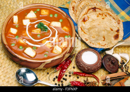 Mattar paneer, matar paneer, muttar paneer, mutter paneer, paneer mattar with paratha Stock Photo