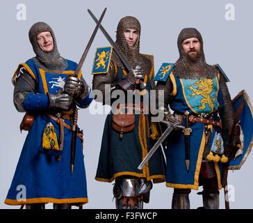 Three Medieval Knights Isolated On Grey Background Stock Photo - Alamy