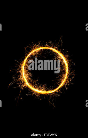 Sparkling light circle isolated on black background. Stock Photo