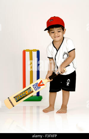 Boy playing cricket ; MR Stock Photo