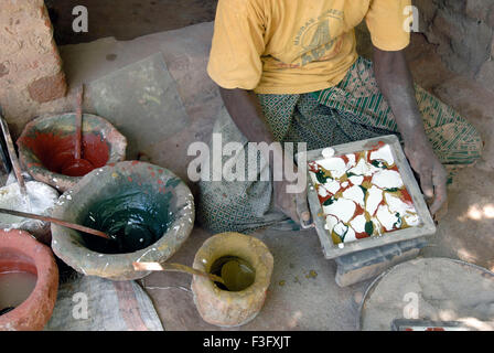 Man making Athangudi tiles which are not ceramic quite heavy and costly ; Tamil Nadu ; India Stock Photo