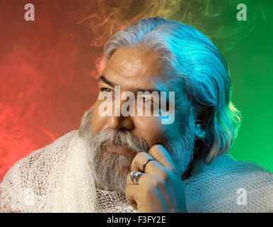 Hindu priest experts in vastu shastra a science of placement ; India ; MR Stock Photo