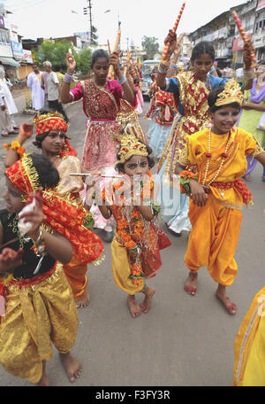 Janmashtami festival Lord Krishna birthday celebration carnival procession musical band children dancing Jabalpur Stock Photo