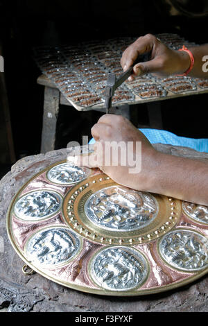 An artisan making Thanjavur Art Plate at Thanjavur Tanjore, Tamil Nadu ...