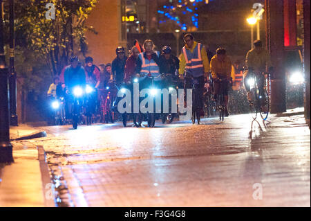 Manchester, UK. 6th October, 2015. Protesters make a 'Campaign Ride' around the Tory conference centre. A week of pro-peace, anti-austerity, anti-war, anti-Tory, protests dubbed 'Take Back Manchester' has been  organised by The People's Assembly and timed to coincide with the Conservative Party Conference in Manchester on 4th - 7th Oct 2015. Over 40 events are planned, including a speech by new Labour leader Jeremy Corbyn timed to compete with closing speech of Tory leader David Cameron. Credit:  Graham M. Lawrence/Alamy Live News. Stock Photo