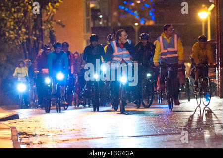 Manchester, UK. 6th October, 2015. Protesters make a 'Campaign Ride' around the Tory conference centre. A week of pro-peace, anti-austerity, anti-war, anti-Tory, protests dubbed 'Take Back Manchester' has been  organised by The People's Assembly and timed to coincide with the Conservative Party Conference in Manchester on 4th - 7th Oct 2015. Over 40 events are planned, including a speech by new Labour leader Jeremy Corbyn timed to compete with closing speech of Tory leader David Cameron. Credit:  Graham M. Lawrence/Alamy Live News. Stock Photo