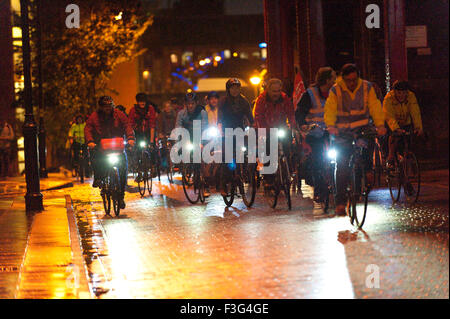 Manchester, UK. 6th October, 2015. Protesters make a 'Campaign Ride' around the Tory conference centre. A week of pro-peace, anti-austerity, anti-war, anti-Tory, protests dubbed 'Take Back Manchester' has been  organised by The People's Assembly and timed to coincide with the Conservative Party Conference in Manchester on 4th - 7th Oct 2015. Over 40 events are planned, including a speech by new Labour leader Jeremy Corbyn timed to compete with closing speech of Tory leader David Cameron. Credit:  Graham M. Lawrence/Alamy Live News. Stock Photo