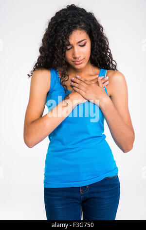 Portrait of afro american woman having pain in heart isolated on a white background Stock Photo