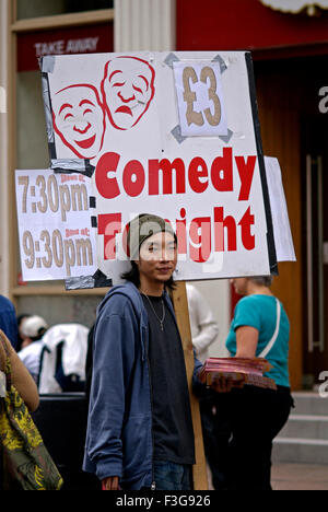 Man carrying placard, Comedy Tonight, Piccadilly Circus, Piccadilly, City of Westminster, London, England, United Kingdom, UK Stock Photo