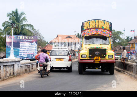 Heavy traffic on narrow bridge river Pazhayar village houses national highway number 47 Suchindram village Tamil Nadu Stock Photo