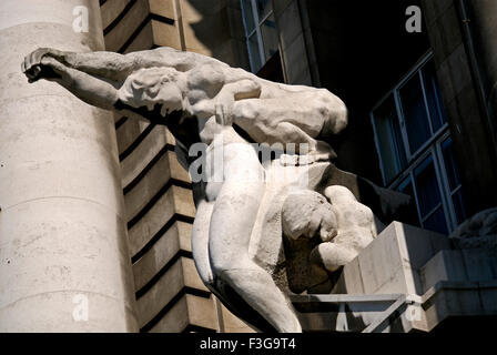 woman carrying man sculpture ; London ; England ; United Kingdom ; UK Stock Photo