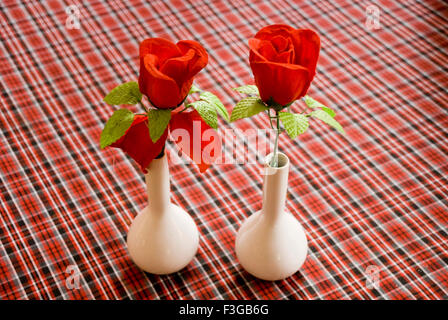 Two vases with two red roses at Ananta Residence ; Mumbai ; Maharashtra ; India Stock Photo