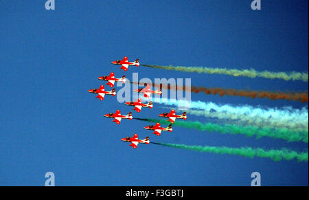 Team Surya Kiran Fighter Planes Flying in Formation Water Arabian Sea Leaving Colorful Smokes Indian Air Force Show Stock Photo