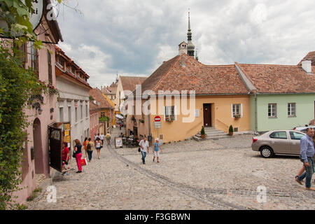 Sighisoara, Romania-July 03, 2015: Colourful crowds of tourists in the Old Town admire monuments Stock Photo