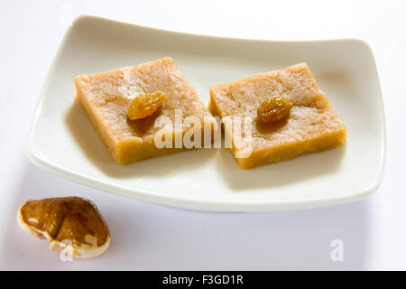 Indian food ; sweet singhada shenghada ka halwa burfi water caltrop flour square shape pudding bonbon trapa bispinosa Stock Photo