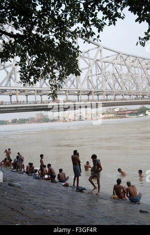 View of Howrah Bridge now Rabindra Setu from bank of river Hooghly ; Calcutta Kolkata ; West Bengal ; India Stock Photo