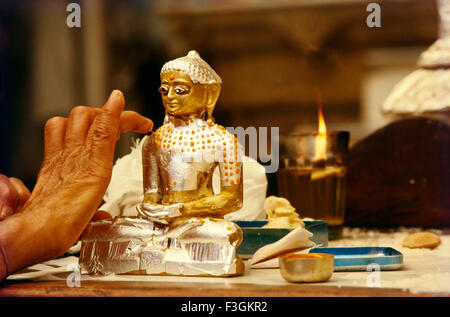 Statue of Lord Mahavir in Jain temple, Mahavira, Vardhamana, Mahaveer, silver statue, gold statue, Bombay, Mumbai, Maharashtra, India Stock Photo